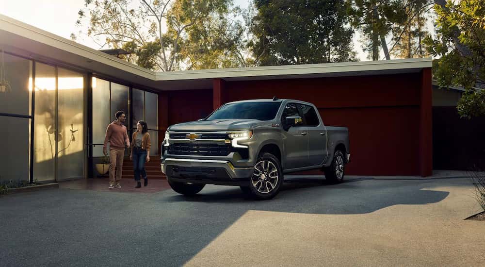 A silver 2025 Chevy Silverado 1500 Z71 is shown parked on a driveway.