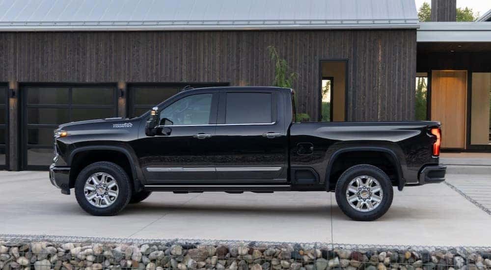 A black Chevy Silverado 2500 High Country is shown parked on a driveway.
