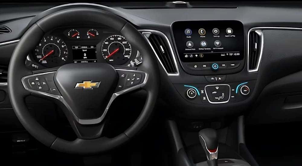 The steering wheel and infotainment screen in a 2025 Chevy Malibu.