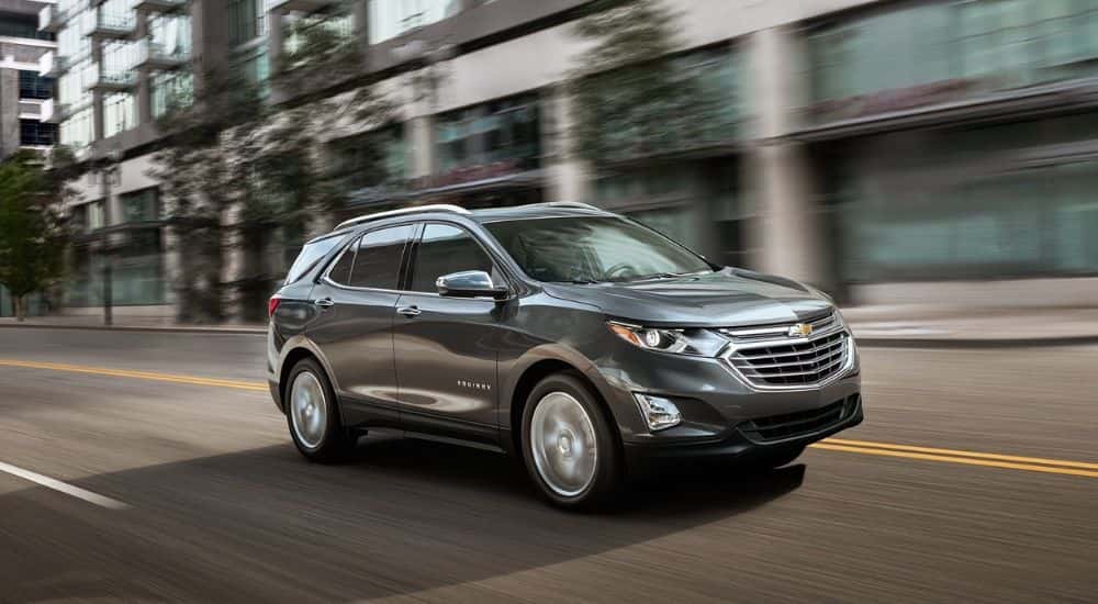 A 2019 Chevy Equinox is shown driving after viewing a used Chevy Equinox for sale in Colonie.