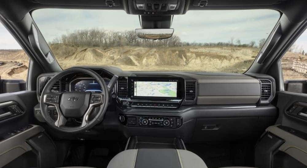 The gray interior and dash are shown in a 2025 Chevy Silverado 2500 ZR2.