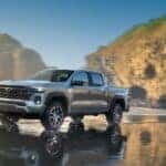 A grey 2025 Chevy Colorado Z71 driving across a beach.