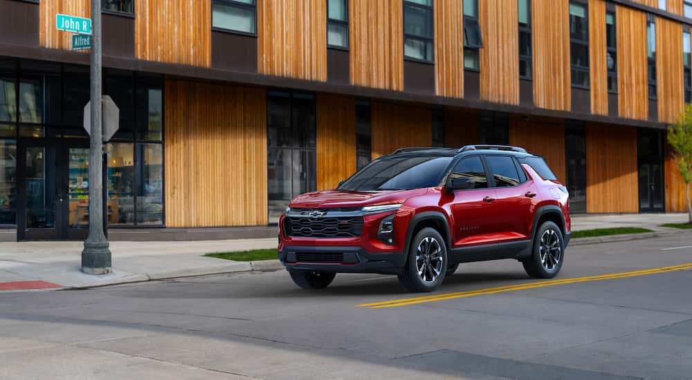 A red 2025 Chevy Equinox RS is shown from the front at an angle.