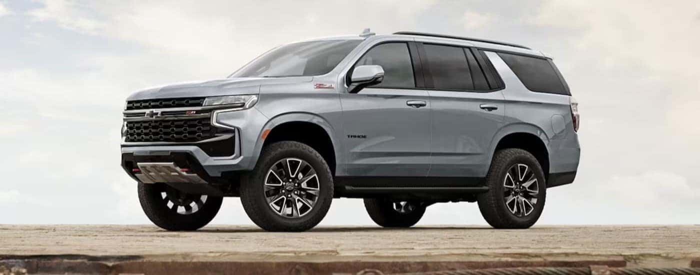 A silver 2024 Chevy Tahoe Z71 is shown parked on a platform.