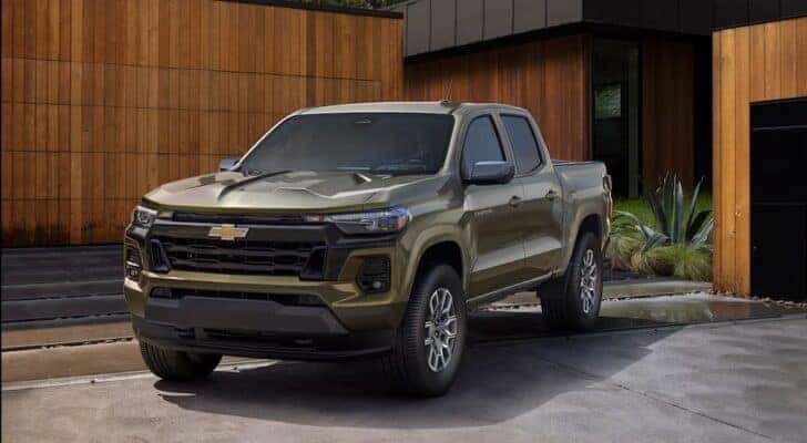 A green 2025 Chevy Colorado for sale in Albany is shown parked on a driveway.