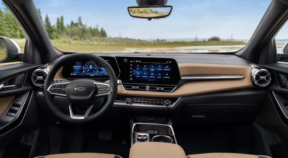The black and tan interior of a 2025 Chevy Equinox ACTIV.