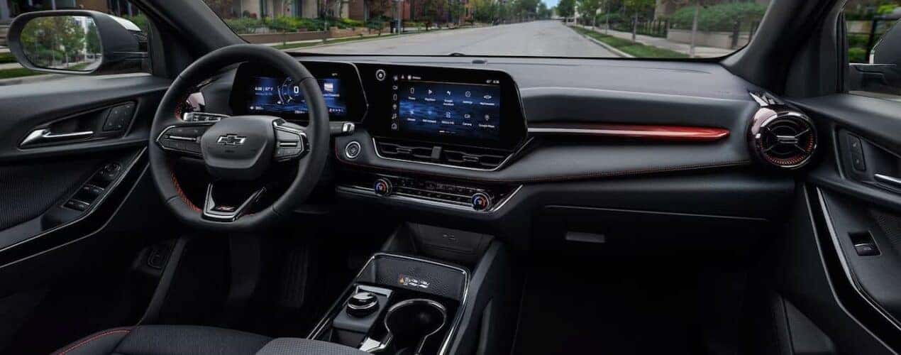 The black interior and dash are shown in a 2025 Chevy Equinox RS.