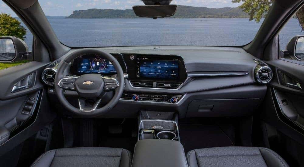 The steering wheel and infotainment screen of a 2025 Chevy Equinox LT.