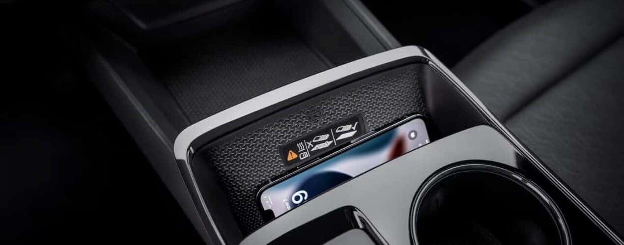 A cellphone is shown charginf in the center console of a 2025 Chevy Equinox LT.