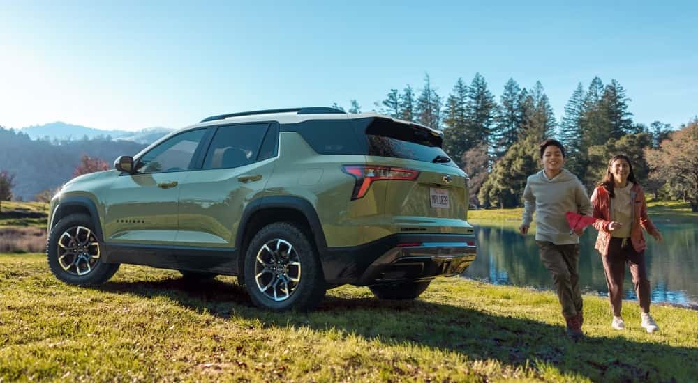 Kids are running near a 2025 Chevy Equinox ACTIV.
