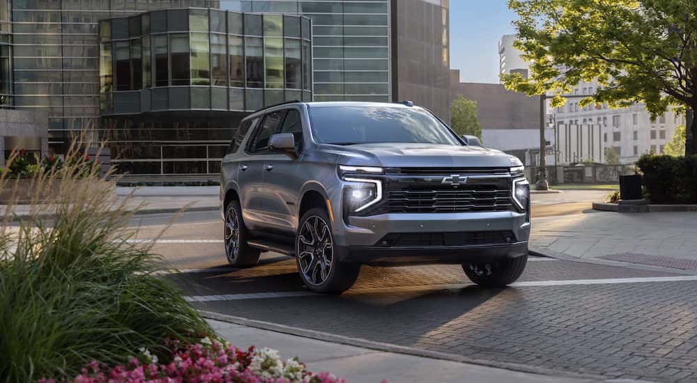 A silver 2025 Chevy Tahoe RST is shown from the front at an angle.