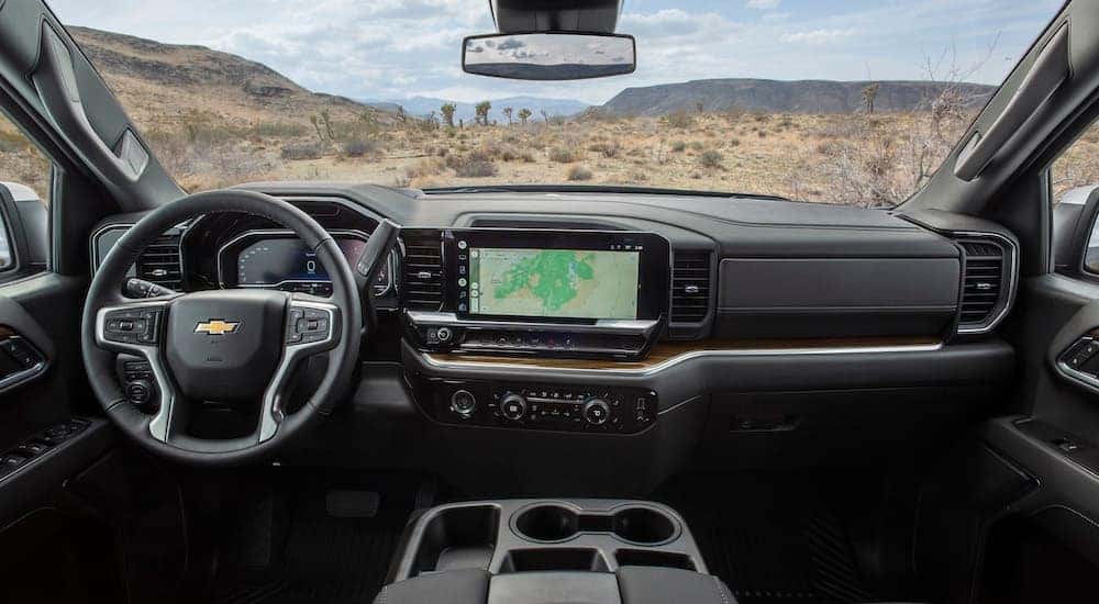 The black interior of a 2022 used Chevy Silverado 1500 for sale in Albany is shown.