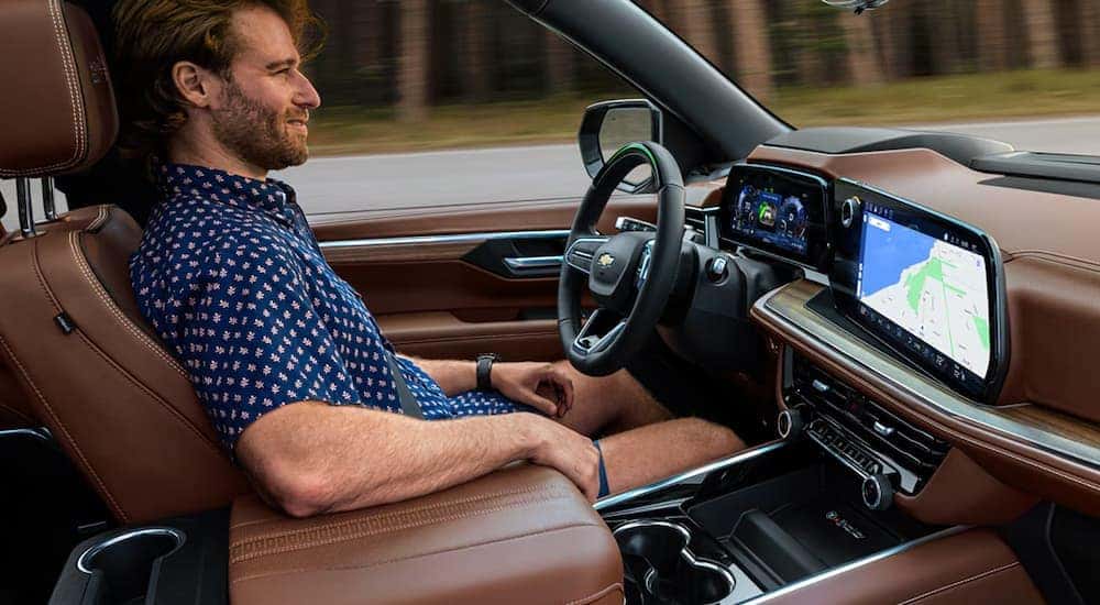 A man using the Super Cruise driving feature in a 2025 Chevy Tahoe.