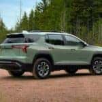 A green 2025 Chevy Equinox ACTIV parked off-road.