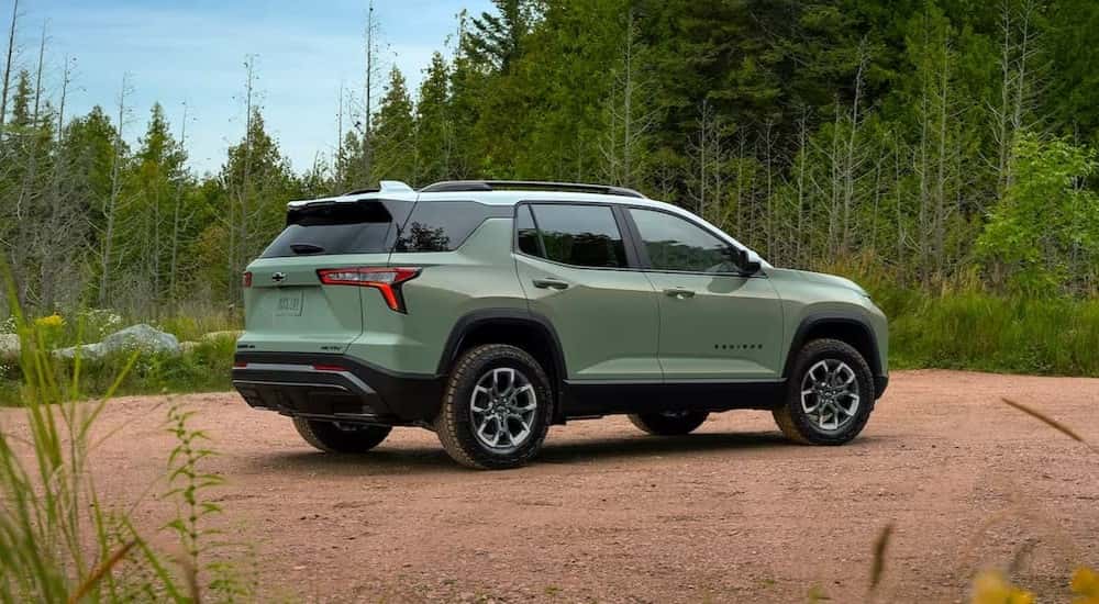 A green 2025 Chevy Equinox ACTIV parked off-road.