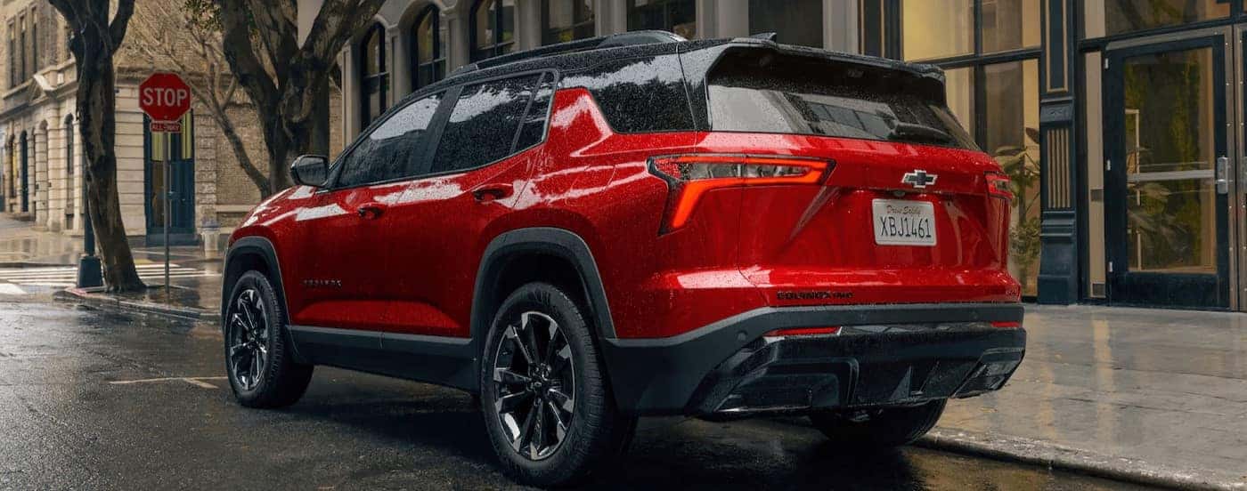 A red 2025 Chevy Equinox RS parked.