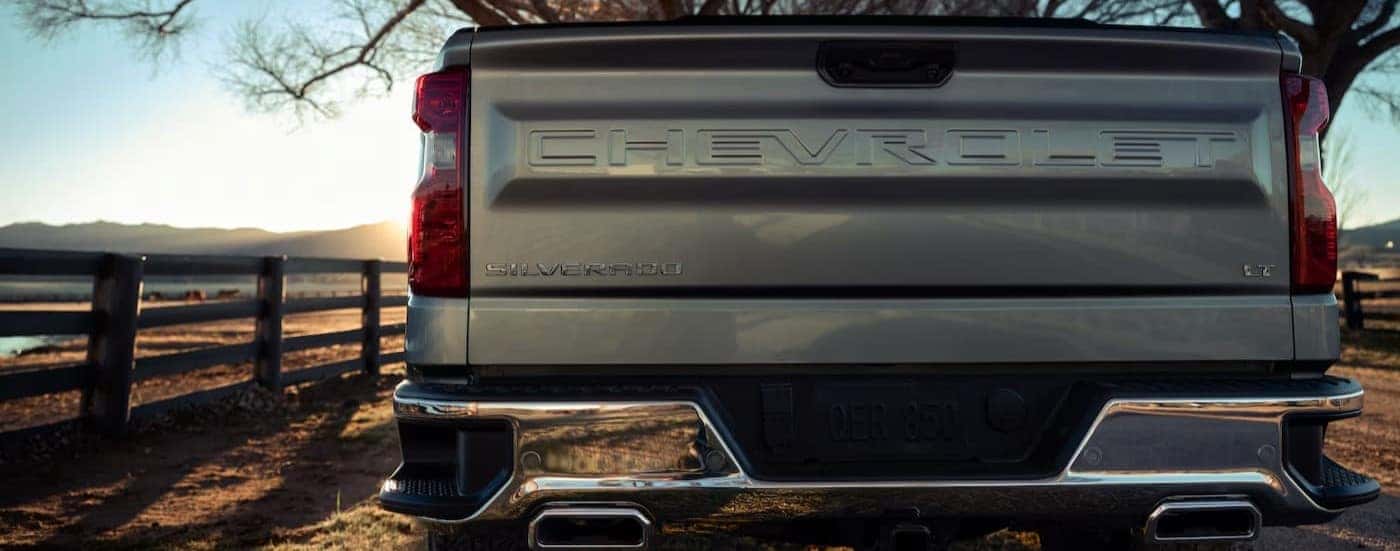 Close-up of the tailgate on a silver 2025 Chevy Silverado 1500 LT.