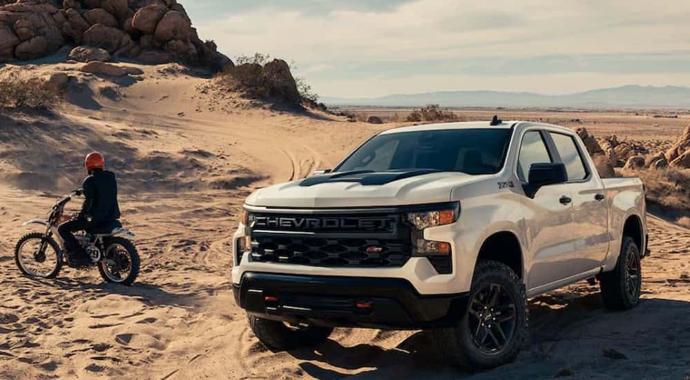 A white 2025 Chevy Silverado 1500 Z71 parked off-road.
