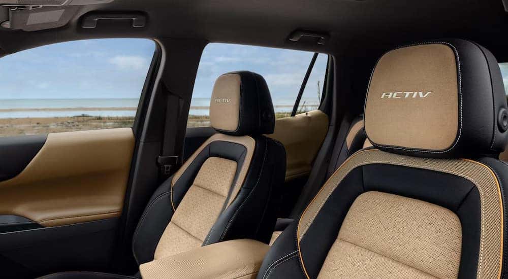 The black and brown interior of a 2025 Chevy Equinox ACTIV for sale near Saratoga Springs.