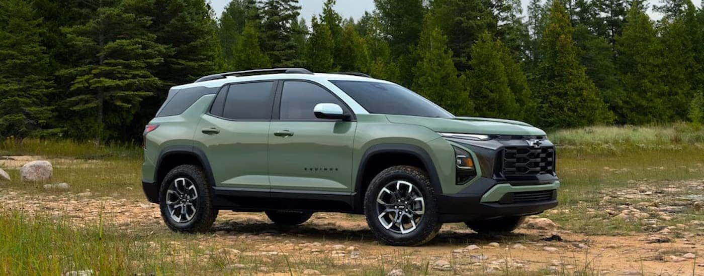 A green 2025 Chevy Equinox for sale near Saratoga Springs is shown.