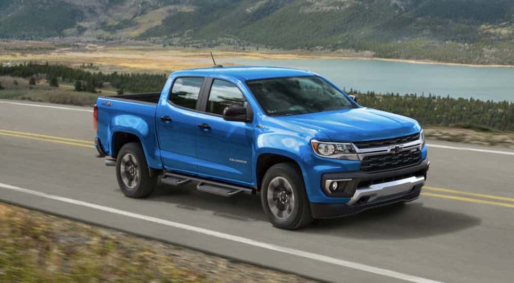 A blue 2022 Chevy Colorado Z71 driving on a highway.