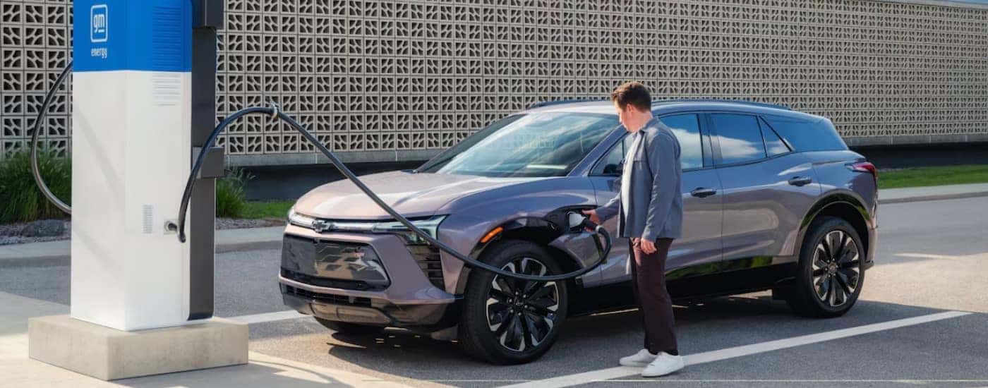 A grey 2025 Chevy Blazer EV being charged.
