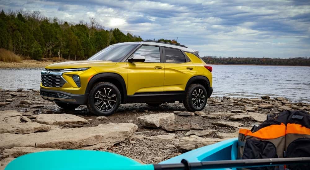 A yellow 2025 Chevy Trailblazer for sale near Amsterdam from the side.