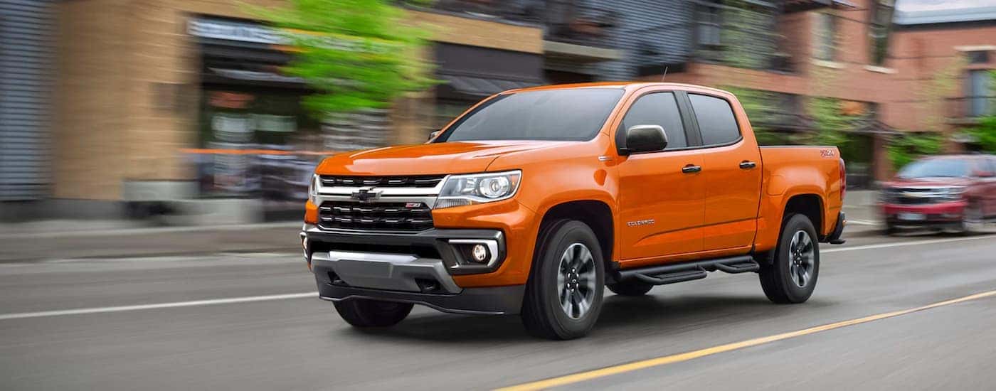 An orange 2021 used Chevy Colorado for sale from the front.