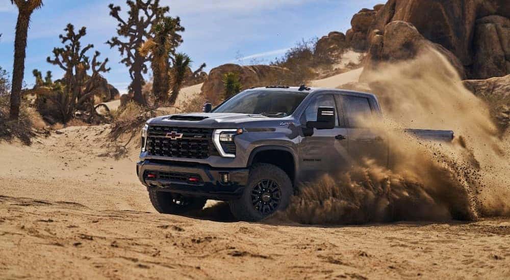 A gray 2025 Chevy Silverado 2500 ZR2 off-roading.