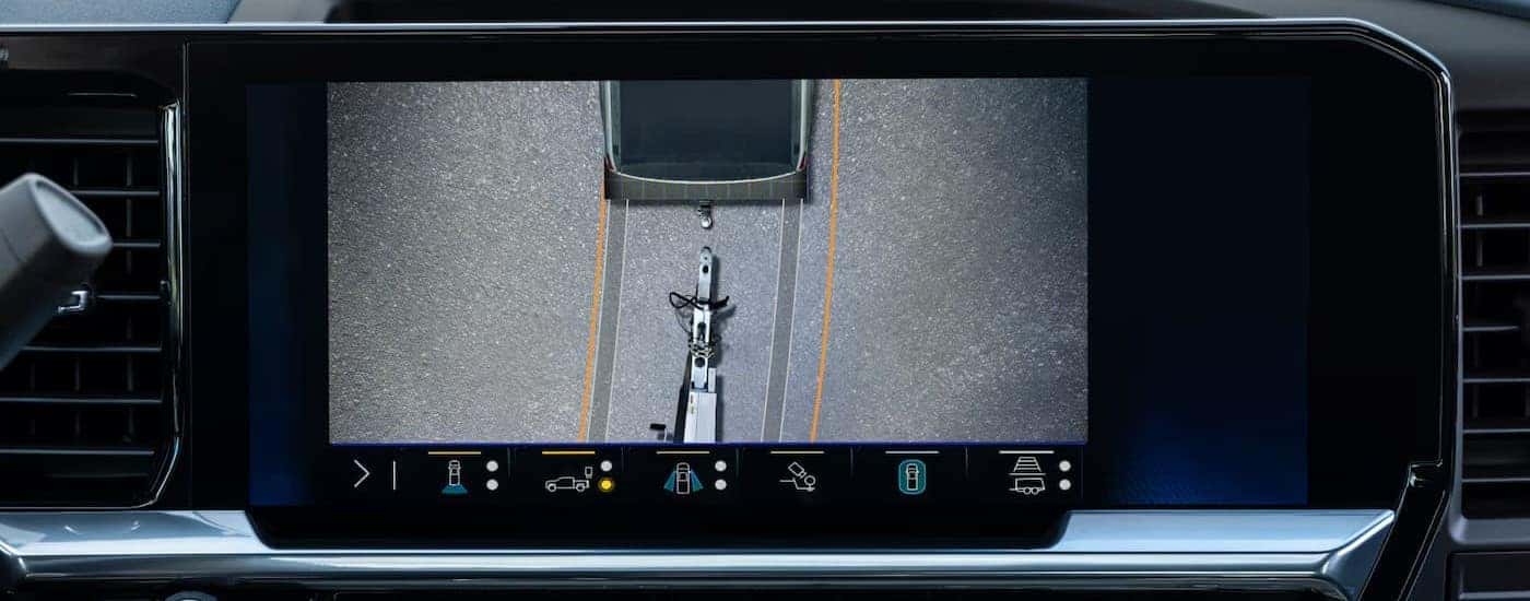 Close-up of the infotainment screen featuring a trailering camera angle in a 2025 Chevy Silverado 2500 HD.