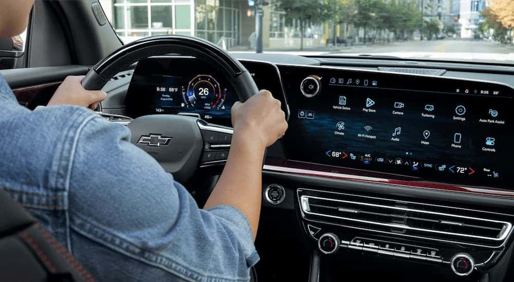 Person test driving a 2025 Chevy Traverse RS for sale in Albany