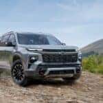 Grey 2025 Chevy Traverse Z71 off-roading on a gravel road.