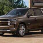 A brown 2021 Chevy Tahoe parked on a driveway.