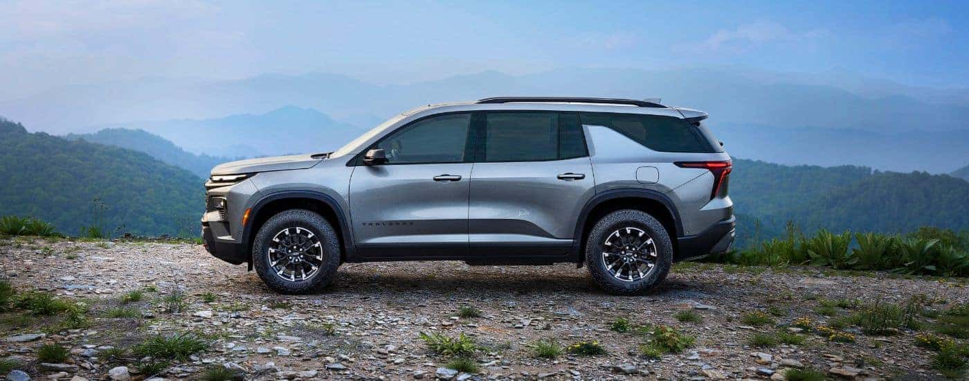 A silver 2025 Chevy Traverse Z71 parked off-road