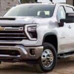 A white 2025 Chevy Silverado 3500 HD parked off-road.