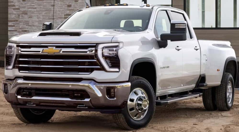 A white 2025 Chevy Silverado 3500 HD parked off-road.