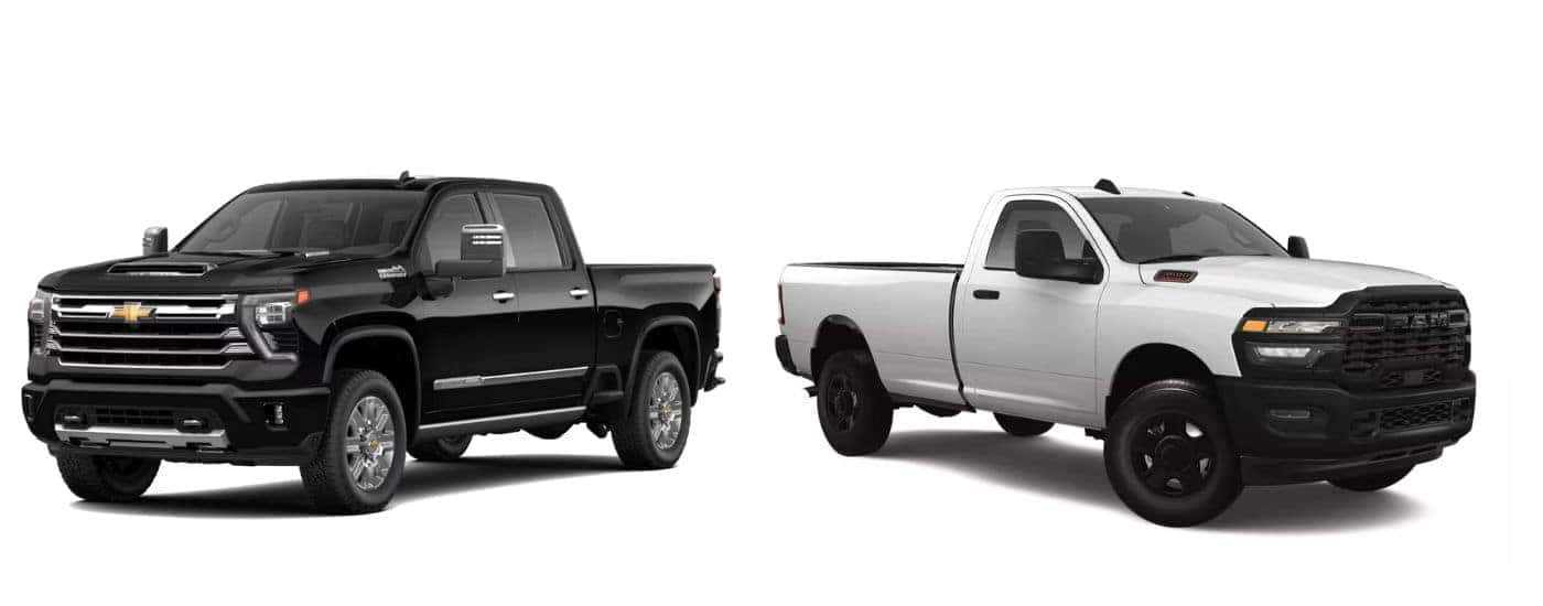 A black 2025 Chevy Silverado 3500 HD vs a white 2025 Ram 3500.