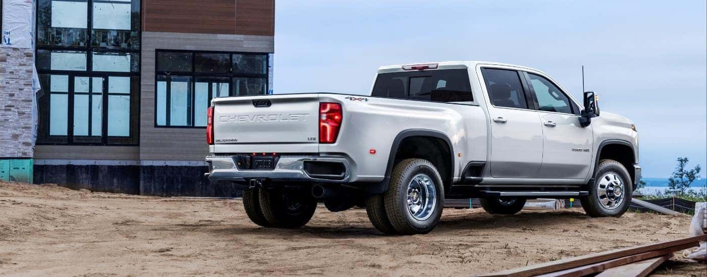 A white 2025 Chevy Silverado 3500 from the rear at an angle.