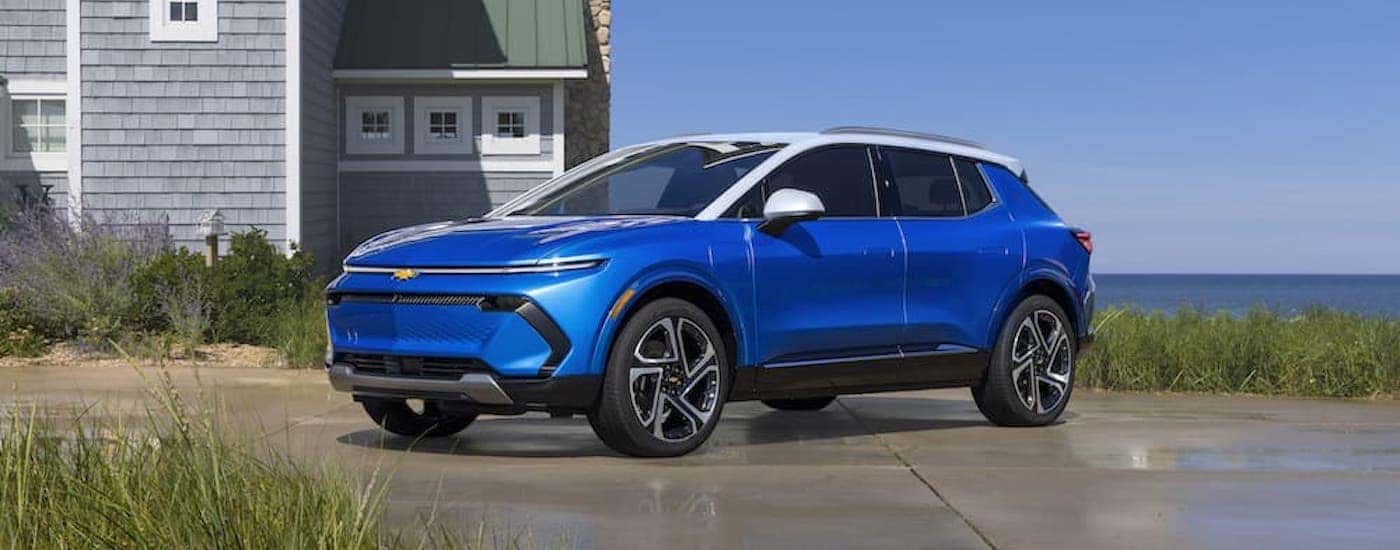 A blue 2025 Chevy Equinox EV from the side.