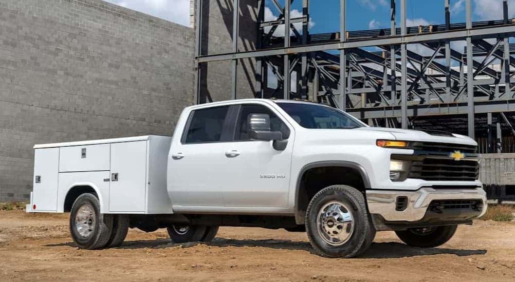 A white 2025 Chevy Silverado 3500 HD parked on a construction site.