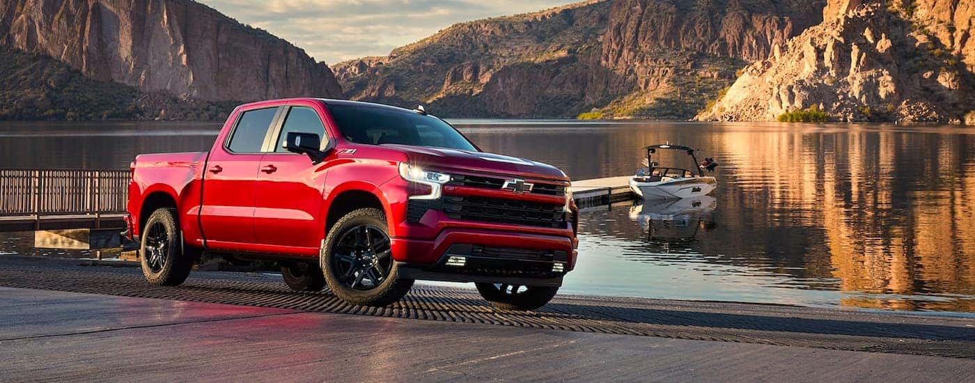 A red 2022 Chevy Silverado 1500 Z71 for sale near Troy parked near a dock.