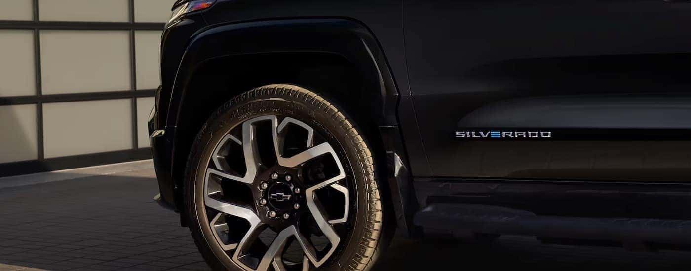 Close up of the side on a black 2025 Chevy Silverado EV
