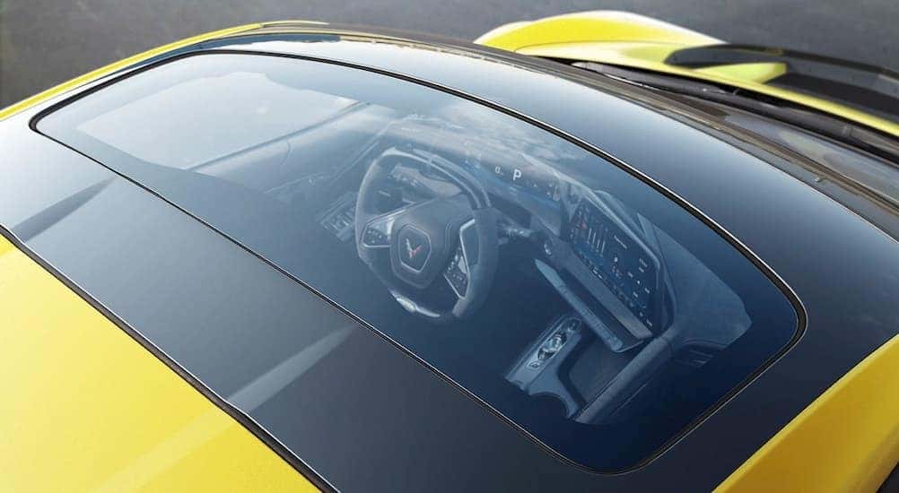 Close-up of a moonroof on a yellow 2026 Chevy Corvette.