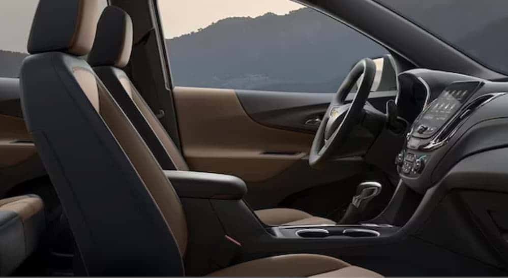 The black and brown interior of a 2024 Chevy Equinox.