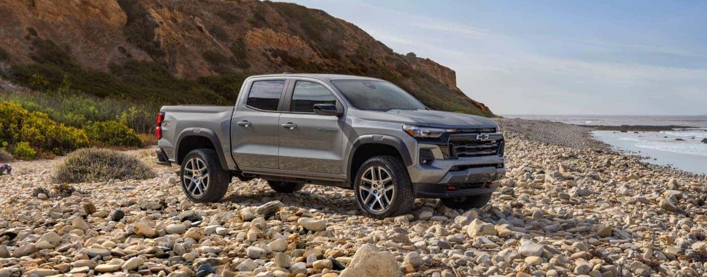 A silver 2023 Chevy Colorado Z71 parked on rocks