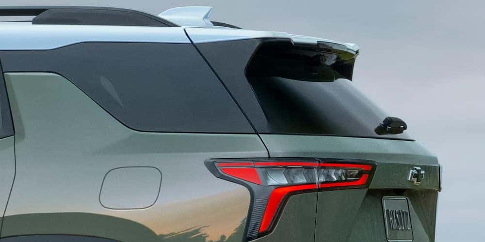 Rear end of a green 2026 Chevy Equinox parked.
