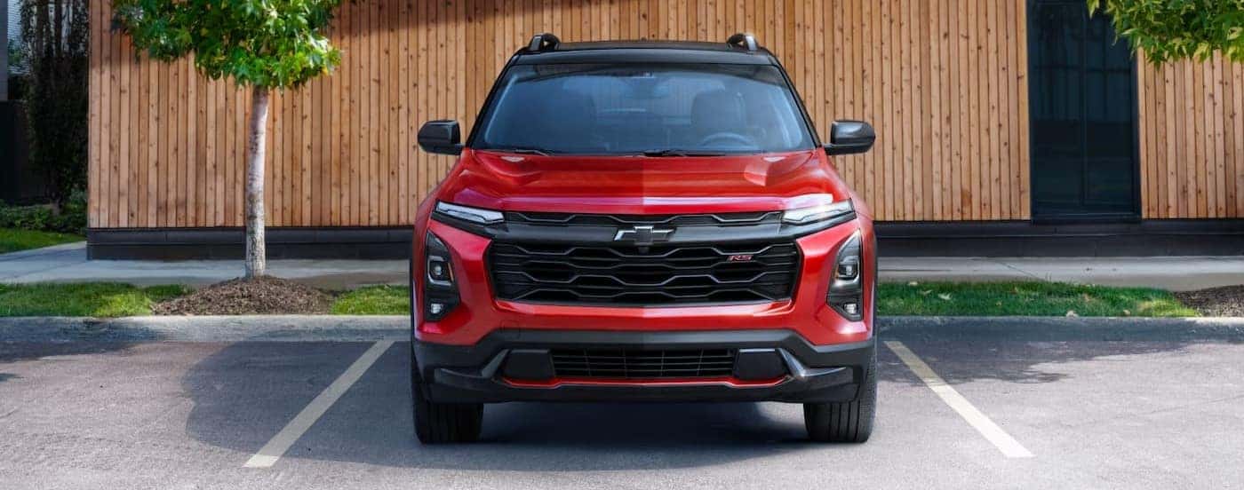 A parked red 2025 Chevy Equinox RS.
