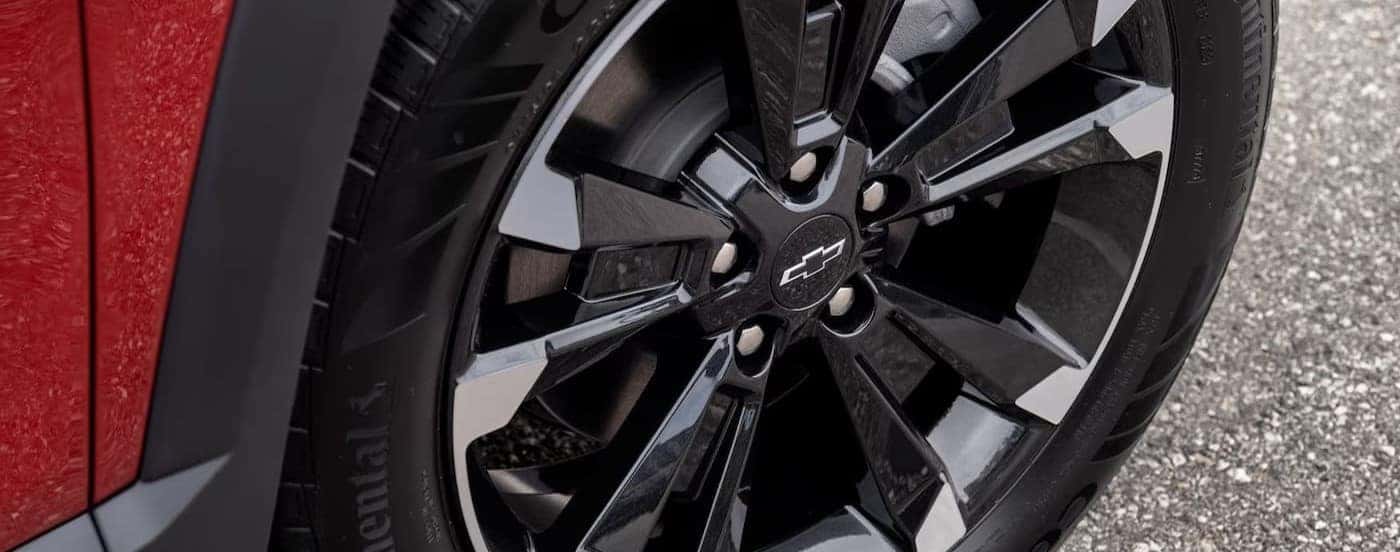 Close-up of the wheel on a red 2025 Chevy Equinox RS.