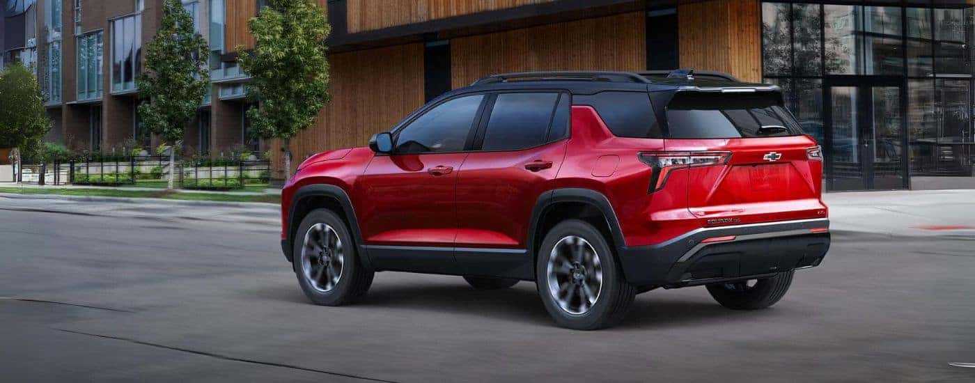 Red 2025 Chevy Equinox RS driving on a city street