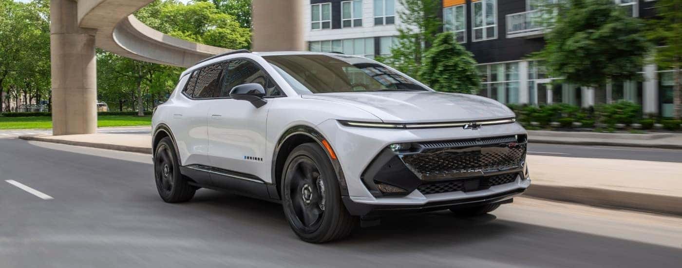 A white 2025 Chevy Equinox EV for sale near Danville from the front at an angle.